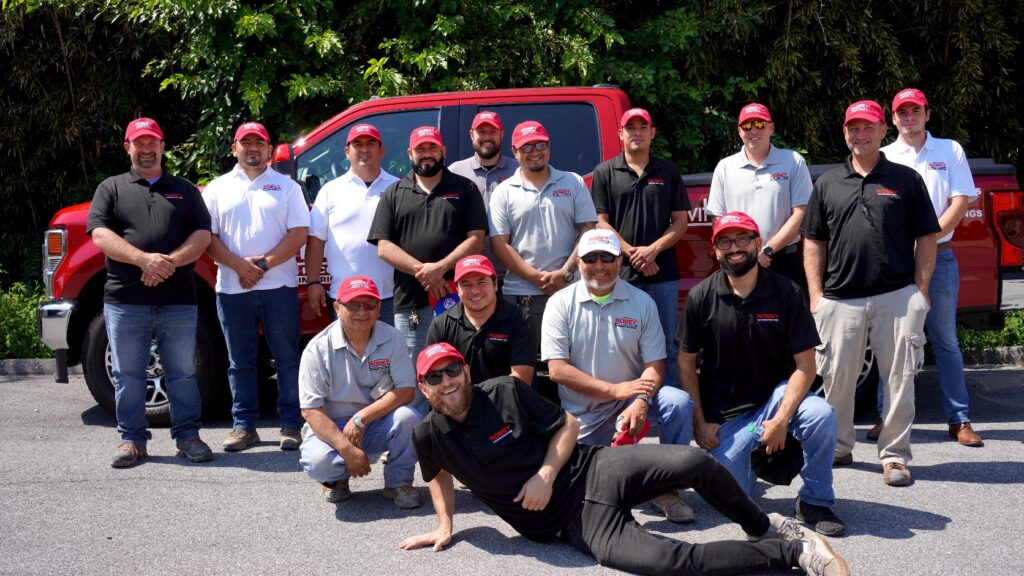 the robey drywall team in front of a company truck