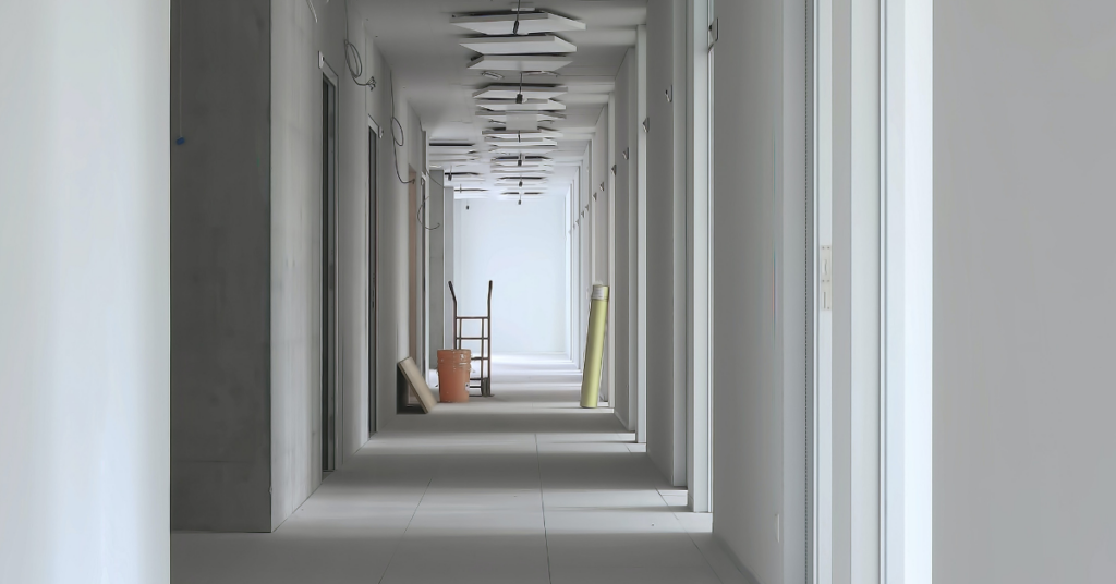 A long hallway with finished drywall walls