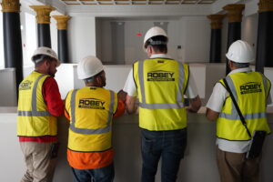 Robey professionals installing drywall