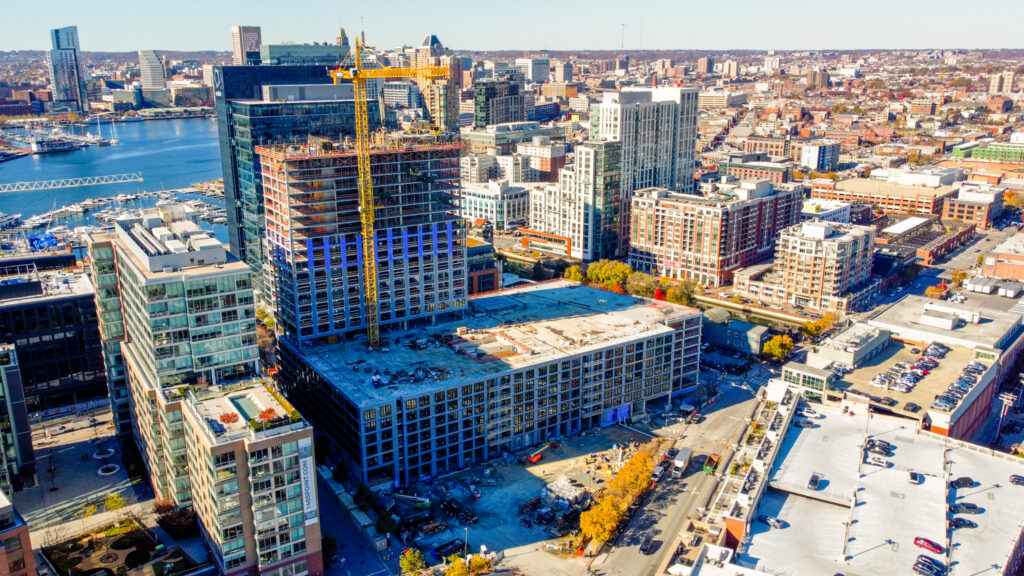 Drone perspective of Parcel 4 construction in Harbor Point, highlighting the structure's integration into Baltimore's urban fabric.