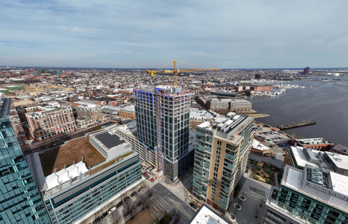 Wide angle distant photo of Allied Harbor Point building during renovation