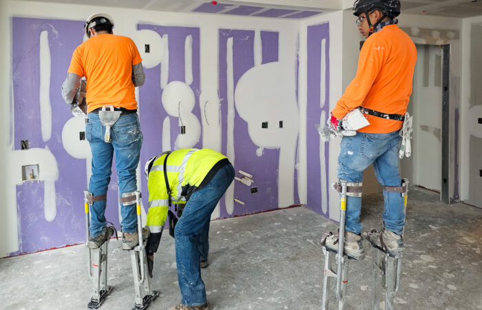 Robey Drywall crew working at Allied Harbor Point Interior of building