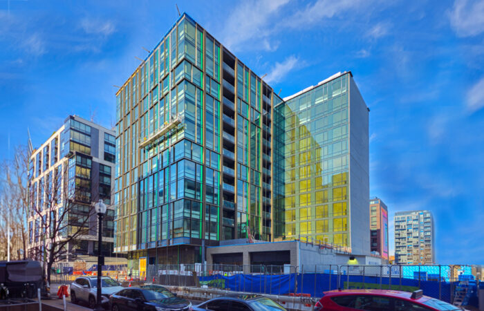 Street view of construction project with glass building