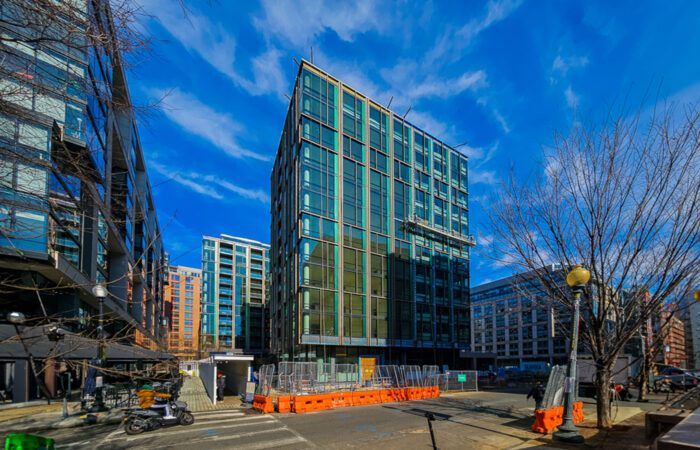Street view of construction project on glass building