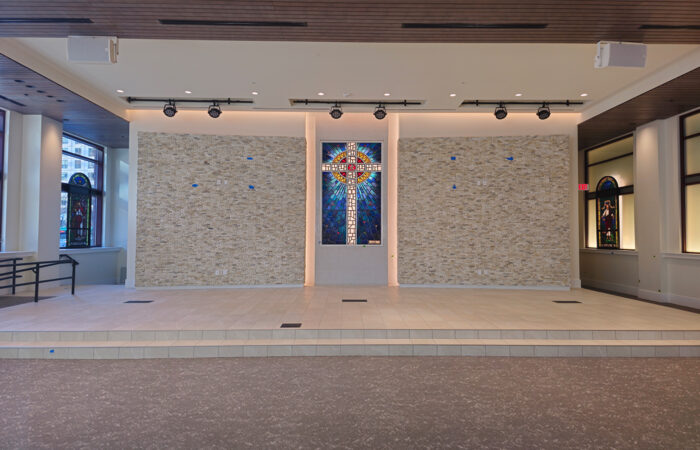 Interior of sanctuary building with stained glass windows