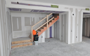 drywall being installed around a staircase