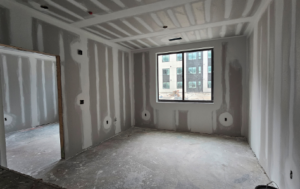 interior of an empty grey room under construction